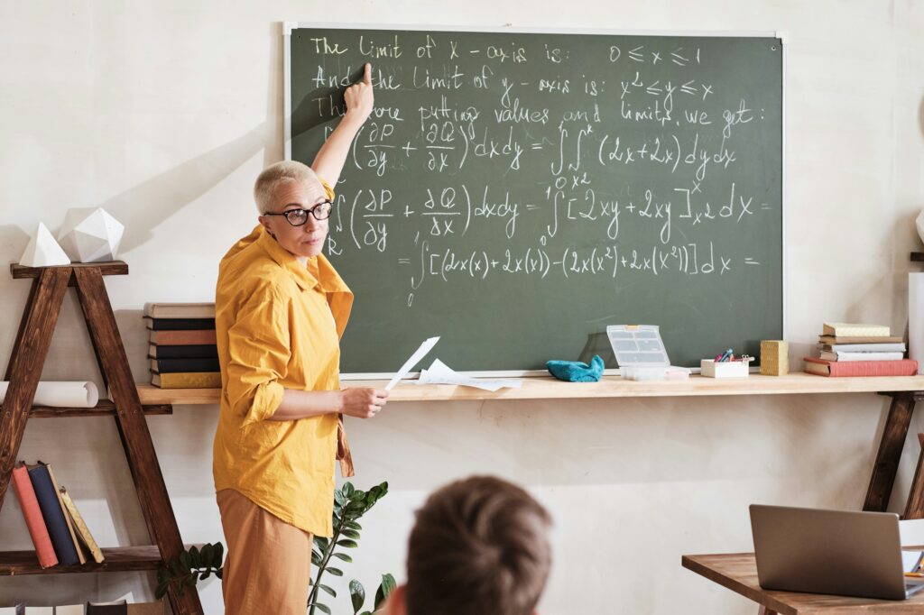 Teacher explaining the maths at school